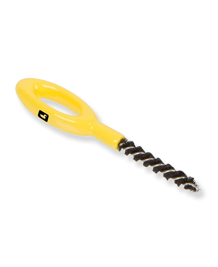 Loon Ergo Dubbing Brush with a bright yellow ergonomic handle and twisted black bristles designed for precise fishing tackle cleaning and fly fishing preparation.