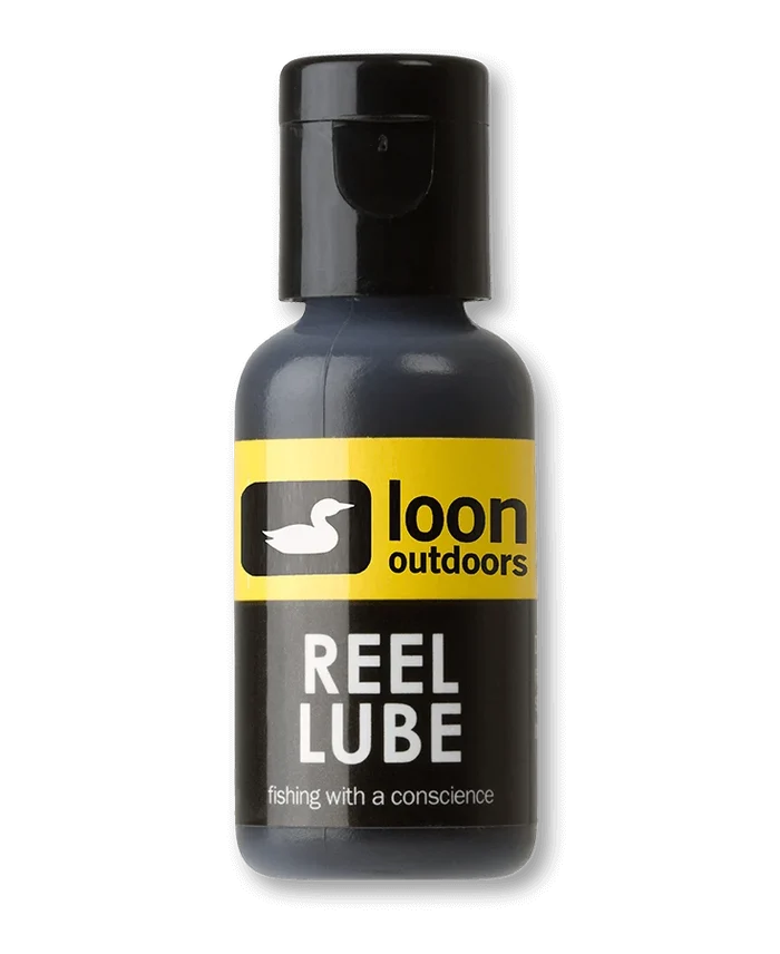 Small black and yellow bottle of Loon Outdoors Reel Lube, a lubricant designed for maintaining fishing rods and reels for smooth performance.