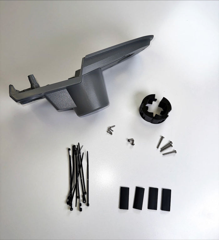 Lowrance Recon Head Base and Wedge Kit Saltwater PN:000-16404-001 showing a gray mounting base, wedge, multiple black cable ties, black spacer pieces, and assorted small screws laid out on a white surface for fishing electronics installation.