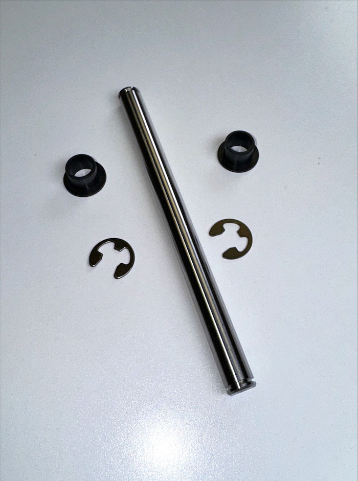 Lowrance Recon Transmission Tilt Pin Kit PN: 000-16387-001 featuring a polished metal tilt pin, two black plastic bushings, and two small metal retaining clips arranged on a white surface.