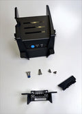 Black protective electronic cover with ventilation slots, status and mode buttons, accompanied by multiple screws and a connector piece, identified as Lowrance Recon UI Cover Freshwater PN:000-16393-001.