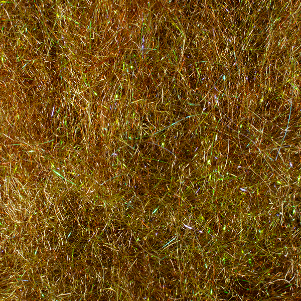 Close-up image of iridescent fibers in shades of brown and green used as fishing lure material, specifically the MFC UV Chub Dub for fly fishing and tackle crafting.