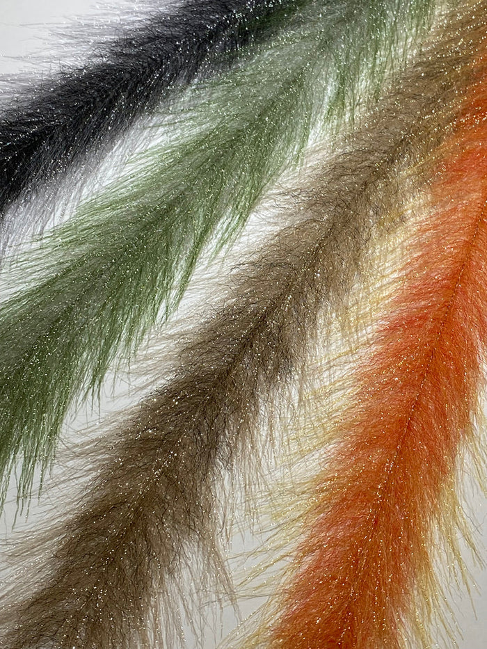 Close-up view of four Mimic Faux Feather Brush strands in black, green, brown, and orange hues featuring fine, wispy fibers with subtle sparkling accents for fishing tackle use.