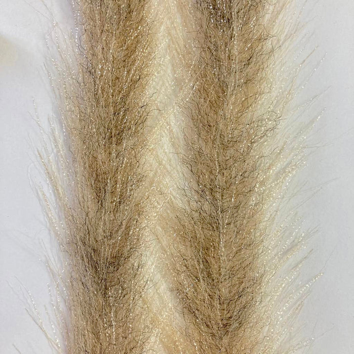 Close-up of two strands of Mimic Faux Feather Brush in light bronze color, showing fine, soft synthetic fibers with shimmering accents for fishing lure and fly fishing tackle.