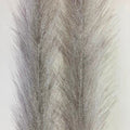 Close-up view of two shimmering grey synthetic feather brushes with fine, soft fibers used for fly fishing lures, labeled as Mimic Faux Feather Brush.
