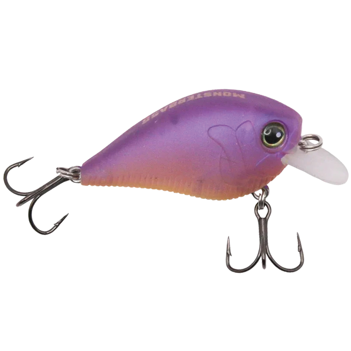 Close-up of a purple and orange Monsterbass Little Banger fishing lure featuring two treble hooks and a small clear plastic lip, designed for attracting musky and freshwater fish.