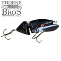 Musky Safari Mini Baby Spitzer black segmented fishing lure with treble hooks, designed for musky fishing and featured by Thorne Bros custom rod and tackle.
