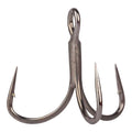 Close-up of a sharp, metallic Mustad Alpha Point Series In-Line 2X Short Triple Grip Treble Hook designed for fishing tackle, featuring three evenly spaced barbed points.
