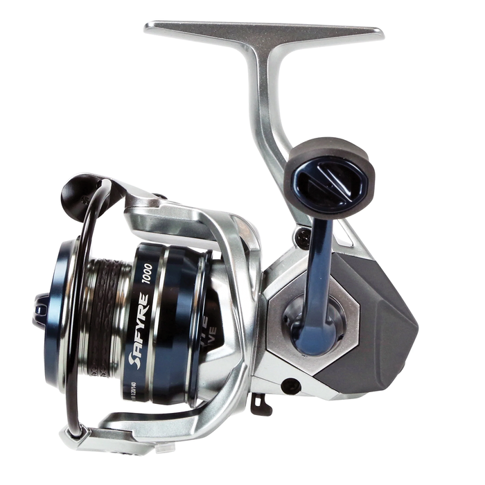 Okuma Safyre spinning fishing reel with silver and dark blue accents, featuring a smooth handle and line spool designed for precision and durability in fishing tackle.