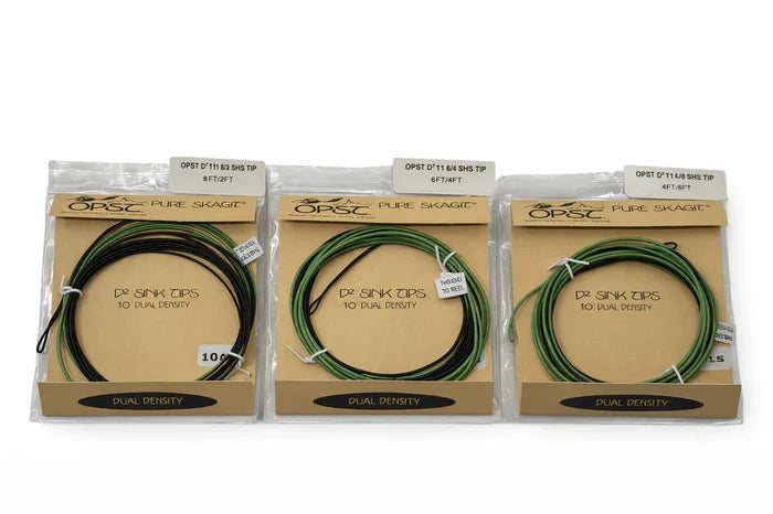 Three packages of OPST Pure Skagit D2 Dual Density Tips in green, each coiled and secured inside clear plastic packaging with cardboard labels, displayed side by side.