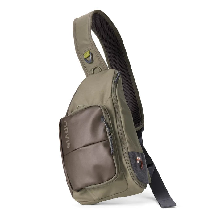 Olive green and brown Orvis Mini Sling Pack with adjustable padded strap, multiple zippered compartments, and mesh padding for comfortable fishing tackle storage.