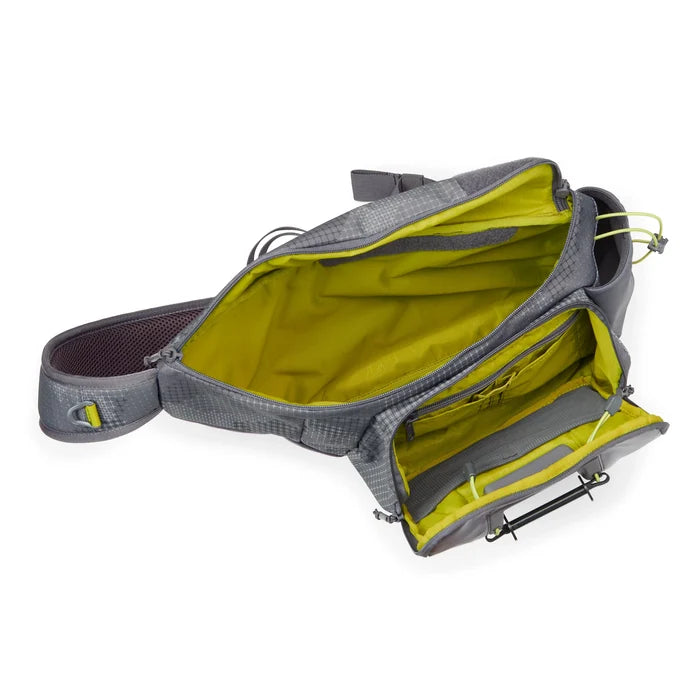 Orvis Sling Pack shown open with a spacious main compartment and multiple interior pockets in yellow lining, designed for organizing fishing tackle and accessories.
