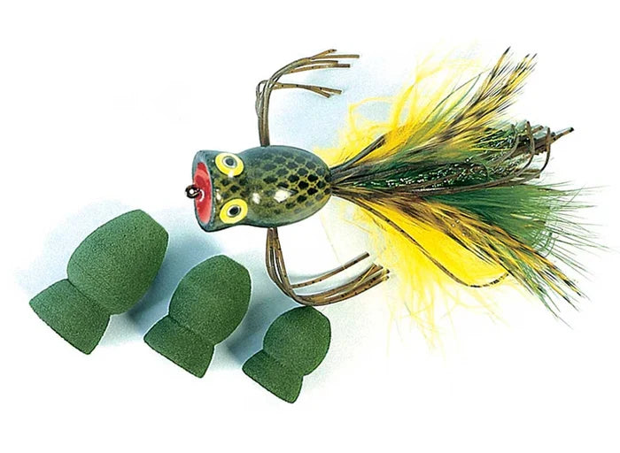Green foam pieces shaped like frog bodies next to a detailed musky fishing lure with yellow and green feathers, showcasing Rainy's Foam Frog Bodies for fishing tackle.