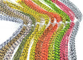 Multiple colorful strands of Rainy's Medium Round Rubber Legs in various vibrant patterns, arranged neatly to showcase their flexible, textured rubber material for fishing tackle.