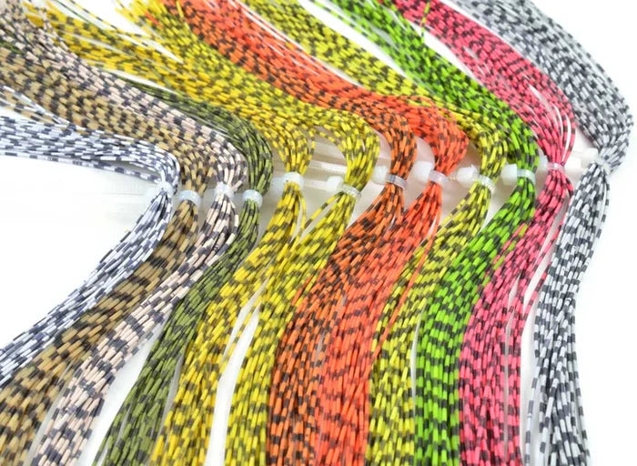 Multiple colorful strands of Rainy's Medium Round Rubber Legs in various vibrant patterns, arranged neatly to showcase their flexible, textured rubber material for fishing tackle.