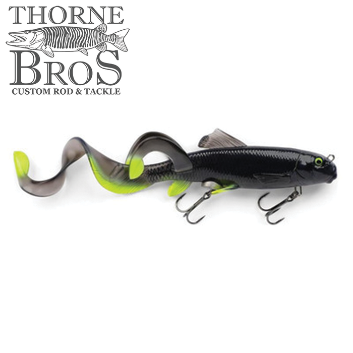 Savage Gear 3D Sucker X-Tail fishing lure in black and chartreuse with two treble hooks and a flexible curled tail designed to mimic natural fish movement for effective fishing tackle.