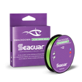 Seaguar Smackdown Braid fishing line in bright green color, shown with spool and purple packaging, designed for high-visibility, ultra-strong fishing tackle use.
