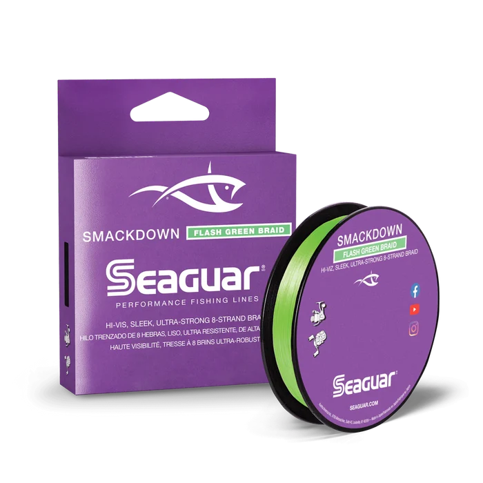 Seaguar Smackdown Braid fishing line in bright green color, shown with spool and purple packaging, designed for high-visibility, ultra-strong fishing tackle use.