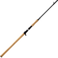 Fishing rod with a light wood grip and black trigger reel seat, designed for musky fishing, labeled Shimano Compre Muskie K, showcasing a sleek black rod blank and line guides.
