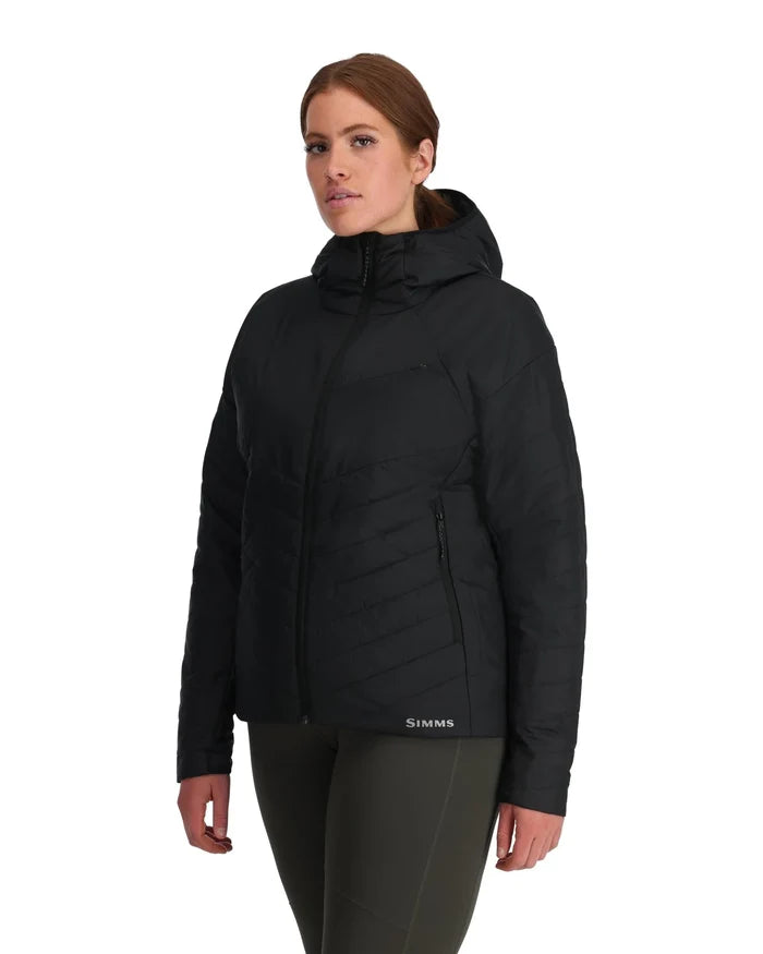 Woman wearing a black insulated jacket with a hood, featuring a front zipper and side pockets, representing the Simms Fall Run Hoody Smokey Olive - Women's.