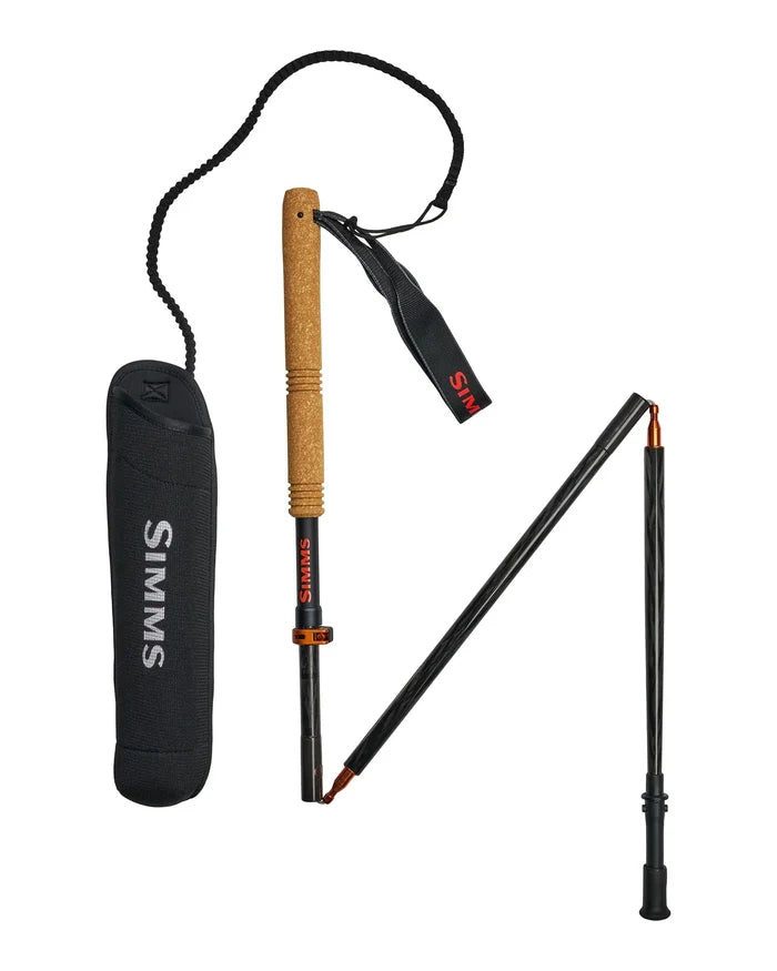 Simms Pro Wading Staff featuring a cork handle, black segmented collapsible shaft, wrist strap, and protective carrying case designed for stability and support in fishing environments.