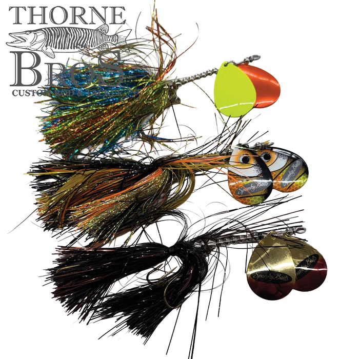 Three colorful Spanky Baits Fireball 8" fishing lures with multi-colored skirts and reflective spinner blades designed for freshwater fishing tackle.