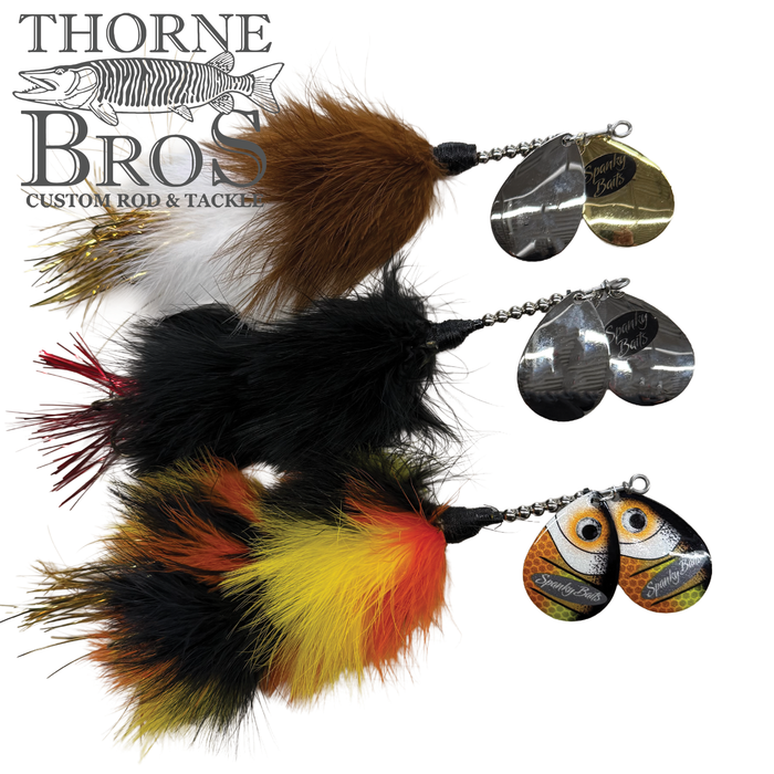 Three detailed fishing lures with feathered tails and metal spinner blades, labeled Spanky Baits Raven, displayed against a white background with Thorne Bros logo.