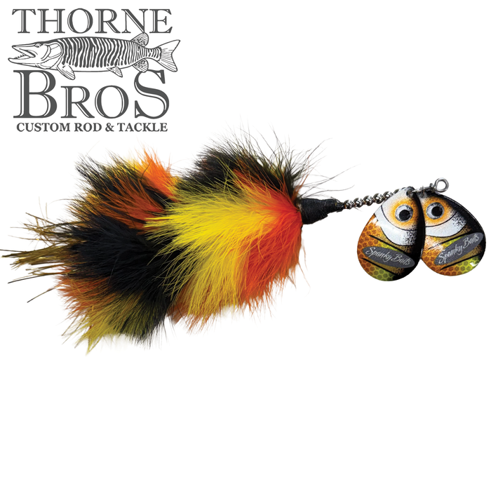 Spanky Baits Raven fishing lure featuring vibrant orange, yellow, and black feathers with two spinning metal blades detailed with eyes, designed for musky fishing tackle.