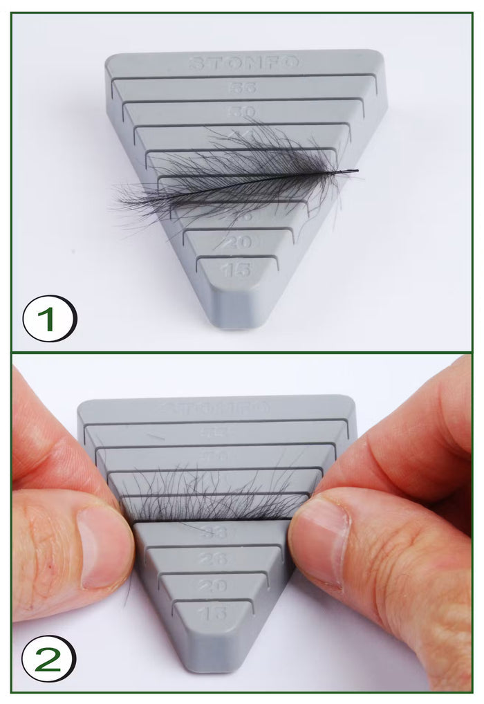 Stonfo CDC Feathers Block showing fine dark feathers held on a gray triangular tool for measuring and organizing fly fishing materials, demonstrated with hands adjusting the feathers.