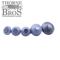 Five round, metallic weights of varying sizes arranged in a row on a white background, designed for fishing use as part of the Suick Weight Kit, with the Thorne Bros logo visible.
