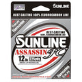 Packaging of Sunline Assassin FC fishing line in silver and black with red and white accents, highlighting 100% fluorocarbon material, 12 lb test strength, and 225 yards length.