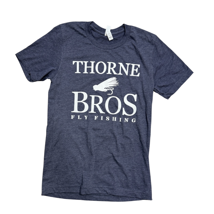 Navy blue cotton Thorne Bros Fly Fishing Logo T-Shirts featuring white text and a graphic of a fishing fly, designed for fishing enthusiasts and casual wear.