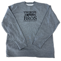 Gray crewneck sweatshirt featuring a black Thorne Bros Logo with a fish graphic and the text "Custom Rod & Tackle" on the front, comfortable and casual fishing apparel.