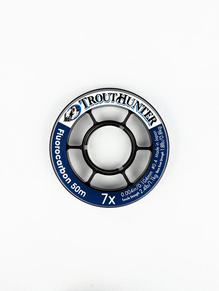 TroutHunter Fluorcarbon Tippet spool displaying 50 meters of clear fluorocarbon fishing line with strength and diameter details, ideal for precise fishing tackle needs.