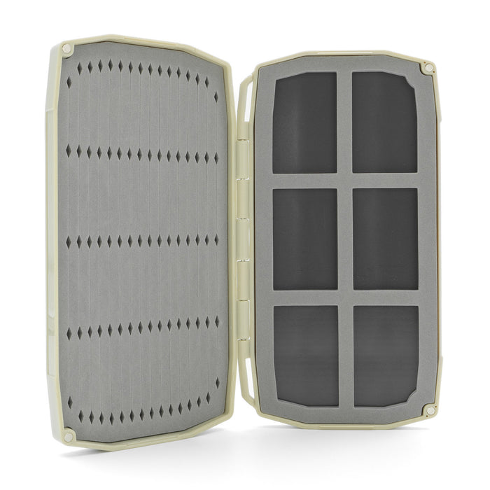 Umpqua Tailwater Foam Fly Box open to show foam insert with slits for securely holding fishing flies, designed in a compact, sturdy case ideal for organizing fishing tackle.