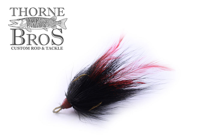 Windels Tied Trebles 5/0 Hook featuring a custom fishing lure with black and red feathered material, designed for musky fishing and premium fishing tackle.